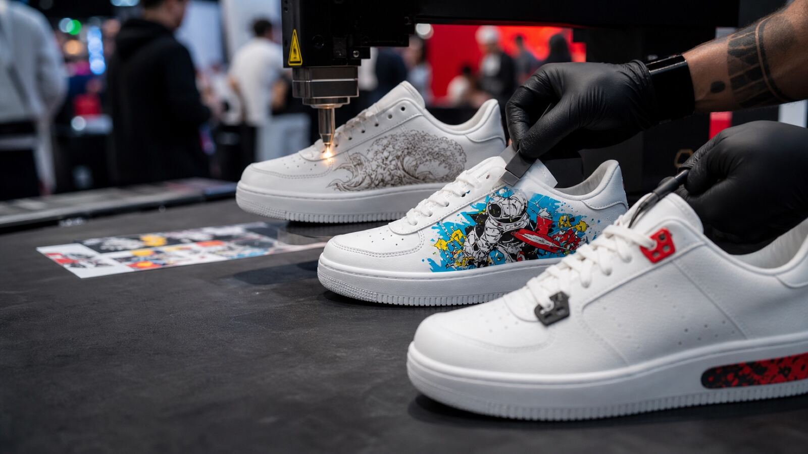 Row of white custom sneakers being detailed at a customization station
